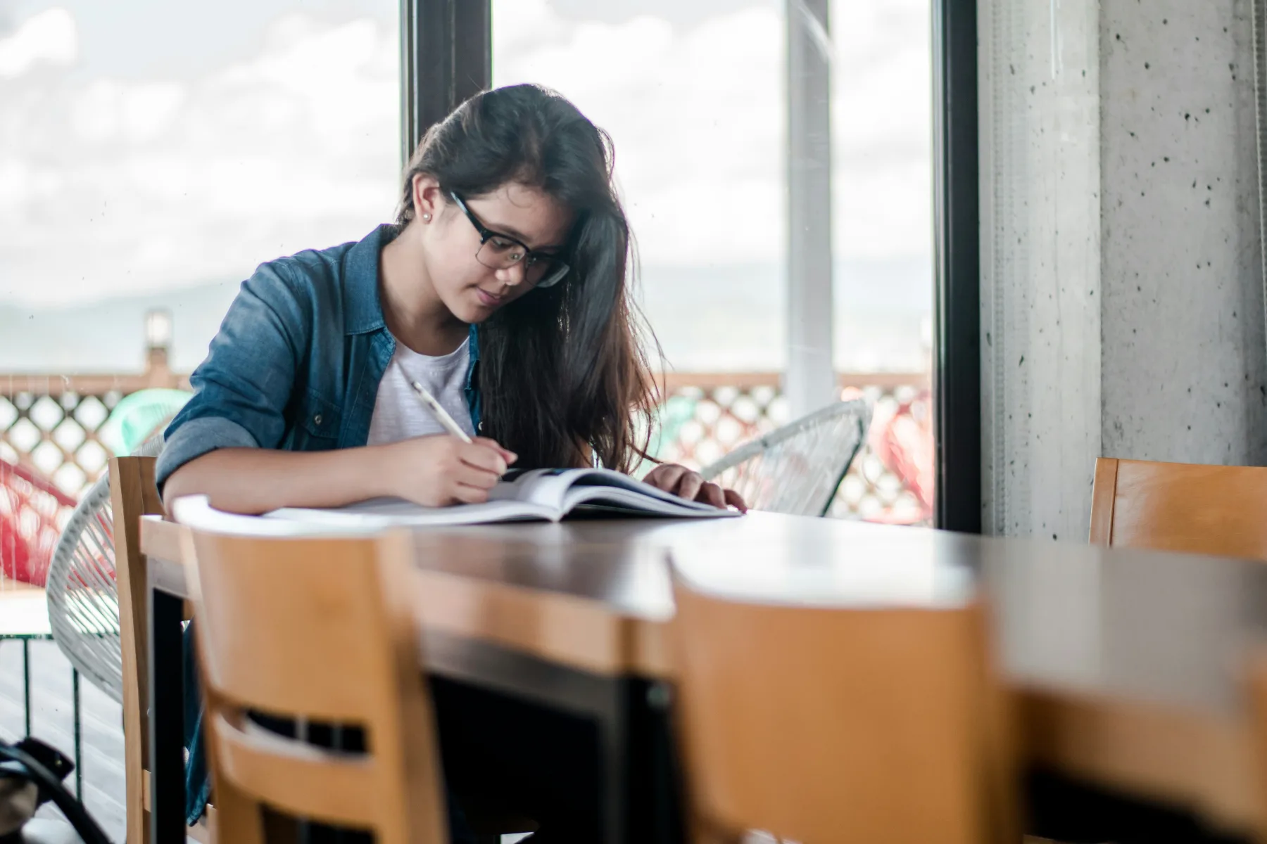 Students studying together around a shared table.